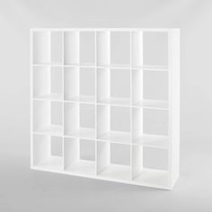 a white bookcase with many compartments on it