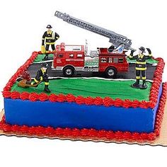 a birthday cake with fire fighters on top