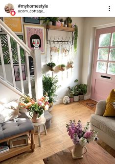 a living room filled with furniture and lots of plants