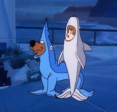 two cartoon characters one is a shark and the other has a dog on its back