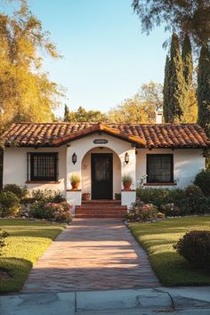 a white house with red tiled roof and door