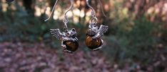 Here are a pair of sterling silver Angel Kitty earrings with 8 mm Tiger eye stones.  These Kittens weigh only 3.0 grams each and measure 3/4 of an inch from ears to tail.  A brand new design from my studio, fully detailed on all sides and clearly marked sterling silver.   The Tiger eye is beautiful African  quarried that has been highly polished with lots of bright yellows and browns. Sterling Silver French ear wires and a gift box included.  Thank you. Cute Round Charms Jewelry, Cute Nickel-free Pendant Jewelry, Cute Round Metal Earrings, Cute Handmade Silver Jewelry, Sterling Silver Hypoallergenic Pendant Earrings, Cute Sterling Silver Dangle Earrings, Cute Adjustable Pierced Jewelry, Symbolic Pierced Dangle Jewelry, Handmade Cute Sterling Silver Jewelry