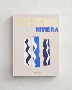 a book with blue, white and yellow stripes on the cover that reads athen's riviera