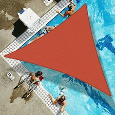 people are swimming in a pool with a red triangle on the bottom and blue water