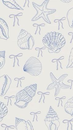 a blue and white wallpaper with seashells on the bottom right hand corner