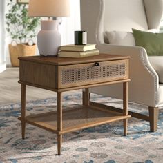 a living room scene with focus on the end table and lamp in the foreground