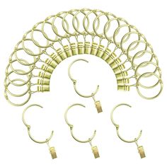 an assortment of gold hoop earrings and earring sets on a white background with clippings