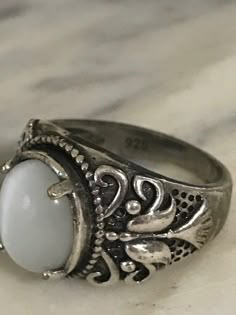 Beautiful Sterling Silver Ring, Vintage Filigree Ring, 925 Silver Chunky ring, Size 9 1/4, Estate Jewelry, Ring for Her What a lovely ring! This ring has white stone that changes shade shade gray depending on the light. I love the designs that it has on the sides. This ring has very good weight and any woman would fall in love with this ring. Perfect to give on any occasion! In great condition! Stone size 17 mm X 14 mm If you purchase more than one item in our shop, we are happy to combine them Chunky Gothic Rings, 70s Silver Jewelry, Chunky Y2k Rings, Chunky Ring With Stone, Cool Chunky Rings, Antique Jewelry Silver, Funky Silver Rings, Silver Chunky Ring, Vintage Jewelry Silver