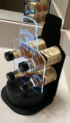 there are several bottles of wine in the holder