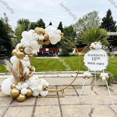 balloon arch with white and gold balloons