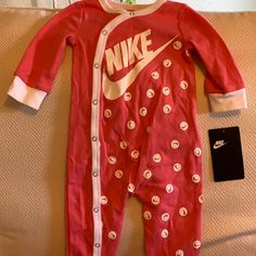 Nike Smoke Free Home Nike Cotton Onesie For Loungewear, Red Cotton Long Sleeve Onesie, Red Long Sleeve Cotton Onesie, Casual Cotton Onesie For Bedtime, Playful Red Onesie For Bedtime, Nike Cotton Playtime Sets, Playful Red Bedtime Onesie, Cute Cotton Onesie For Sleep, Cute Cotton Sleep Onesie