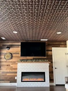 a fireplace with a television above it