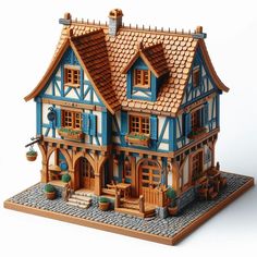 a wooden model of a blue and white house