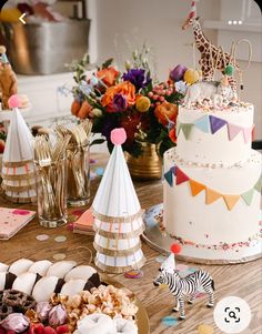 a table topped with lots of cakes and desserts