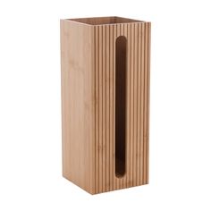 a tall wooden vase sitting on top of a white surface