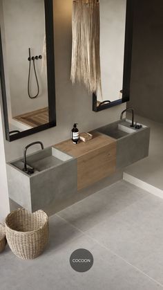 a bathroom with two sinks and mirrors in it