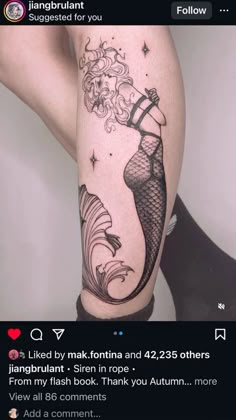 a woman's leg with an image of a mermaid on it and the words, i