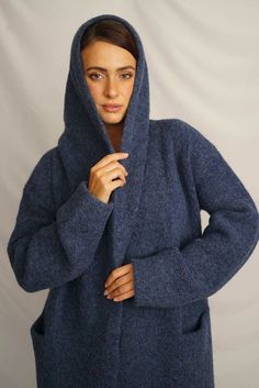 Wrap yourself in the warmth, comfort, and style of the Belen Alpaca Long Hooded Cardigan, a versatile knitwear piece designed to keep you warm and stylish throughout the seasons. Crafted from a luxurious alpaca blend, this cardigan/coat with a hood is elegant and sophisticated, making it perfect for both casual and dressier occasions. - Luxurious Alpaca Blend.- Fashionable and elegant design, the hood adds extra warmth and protection.- Practical pockets.- Versatile length that flatters all body Oversized Knit Warm Outerwear, Warm Cozy Hooded Jacket For Winter, Cozy Warm Hooded Jacket For Winter, Cozy Warm Hooded Winter Jacket, Winter Knitted Cozy Fit Outerwear, Knitted Cozy Fit Outerwear For Winter, Winter Cashmere Cardigan With Shawl Collar, Cozy Knit Winter Outerwear, One Size Winter Knit Sweater Coat