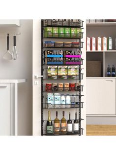 a kitchen pantry filled with lots of food and drinks next to a wall mounted spice rack