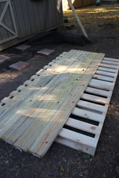 a wooden pallet laying on the ground