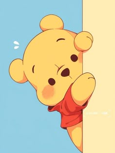 a winnie the pooh holding on to a wall