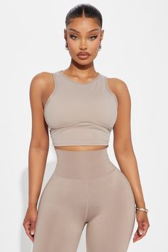 Available In Sage And Taupe. Super Soft Active Top Sleeveless High Neckline Underbust Binding Back Cut Out Ruching Back Tie Pair with "Pilates Girl Active Flare Pant" 75% Nylon 25% Spandex Imported | Pilates Girl Active Top in Taupe size 2X by Fashion Nova Sleeveless Gym Crop Top With Built-in Bra, Compressive Sleeveless Activewear With Built-in Bra, Sleeveless High Stretch Crop Top With Built-in Bra, Beige Stretch Vest Crop Top, Fitted Sleeveless Activewear For Light Exercise, Sleeveless High Stretch Sports Bra For Pilates, Seamless Compression Sleeveless Top, High Stretch Sleeveless Sports Bra For Pilates, Compression Sleeveless Tops With Seamless Construction