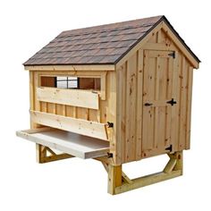 a wooden bird house with a ramp to the roof and side windows on it's sides