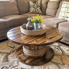 a living room with a couch, coffee table and pillows