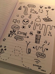 an open notebook with doodles on it