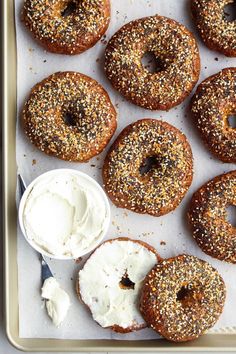 bagels with cream cheese and sprinkles on a tray