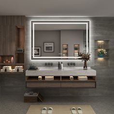 a bathroom with a large mirror above the sink and two candles on the counter next to it