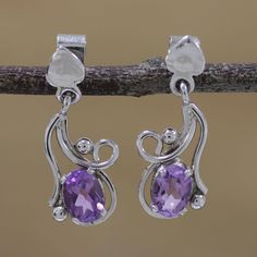 With a shining beauty, sterling silver is formed into elaborate, twisting shapes and given a rhodium bath. Two carats of purple amethyst stones are featured in this beautiful pair of dangle earrings from India. Adorning the ears on heart-shaped posts, this loving accessory is presented by Alok Jain. Moonstone Pendant Necklace, Amethyst Stones, Ruby Pendant, Moonstone Pendant, Amethyst Stone, Jewelry Packaging, Necklace Sizes, Jewelry Gift Box, Purple Amethyst