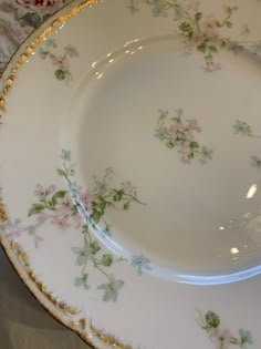 a plate with flowers on it sitting on a table