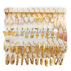 PRICES MAY VARY. [VALUE HOOP EARRINGS]: Well-chosen fashion earrings set, 24 pairs including hoop earrings and dangle earrings, suitable for women and girls. Catch the whole lot in an action, enrich your jewelry box. [QUALITY MATERIAL]: Made of high quality alloy, 14k gold plated, nickle and lead free, no harm to your ears, lightweight and no burden to ears. [UNIQUE DESIGNS]: Each earring has a unique design, The set has various styles, wear together or separately or match it with your other jew Earring Sets, Jewelry Appraisal, Silver Wedding Bands, Vintage Pearl, Hoop Earring Sets, Pearl Earring, Color Vintage, Earring Type, Vintage Pearls