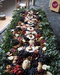 a long table covered in lots of different types of food