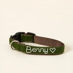 a green dog collar with the words bony on it's front and bottom