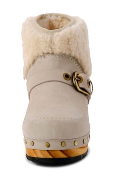 Fuzzy shearling trim updates the cozy-chic vibes of this clog-inspired boot while polished studs accentuate the wood-grain sole. 1 1/2" heel 5" shaft Pull-on style Cushioned footbed Leather and genuine shearling (India) upper and lining/rubber sole Imported Winter Leather Clogs With Faux Fur Lining, Leather Clogs With Faux Fur Lining For Winter, Sheepskin Clogs, Dust Bunny, Clog Boots, Chic Vibes, Shearling Boots, Cozy Chic, Kids Sneakers