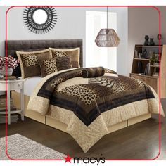 a leopard print comforter set on a bed