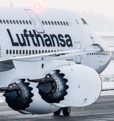 an airplane is parked on the tarmac with it's gear attached to its wheels