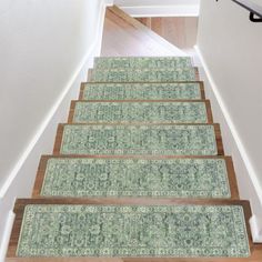 a set of carpeted stairs leading up to a door