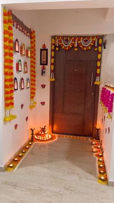 an entrance decorated with candles and decorations