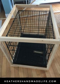 a dog crate is sitting on the floor