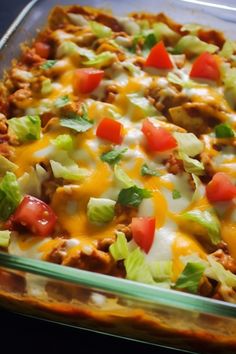 a casserole dish filled with meat, cheese and veggie toppings