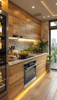 a kitchen with wooden cabinets and stainless steel appliances, along with an outdoor deck area