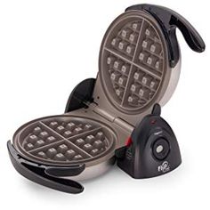 the waffle maker is sitting on top of it's stand with its lid open