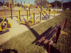 an empty park with yellow and black equipment