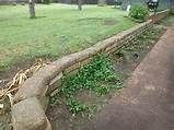 a stone wall in the middle of a yard