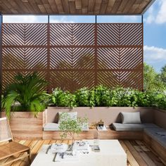 an outdoor living area with wooden flooring and walls covered in wood slatted screens