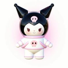 a cute little doll with black and white hair wearing a space suit on it's head