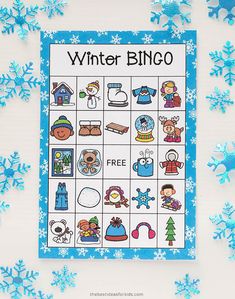 a winter bingo game with snowflakes around it